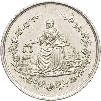 an image of a silver coin with a woman sitting on a bench