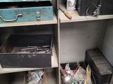 a metal cabinet with a bunch of items in it
