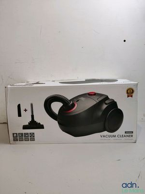 the box of the vacuum cleaner is open on the table