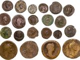 a collection of ancient roman coins, including the head of a woman
