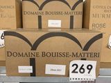 a pile of boxes on a table with a price tag on it