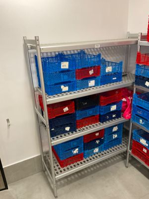 many baskets on the shelves in the room