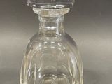a clear glass bottle with a clear lid on a table
