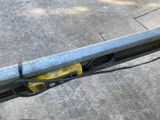 a close up of a metal pole with wires attached to it