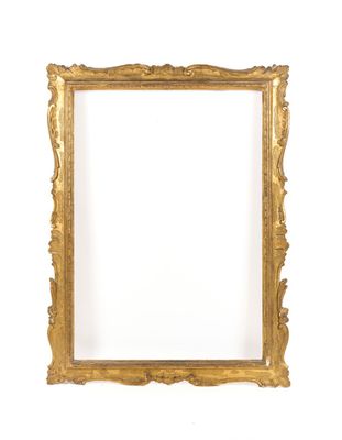 a gold frame with a white background and a white wall