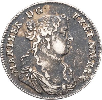 une pièce de monnaie en argent portant un visage de femme
