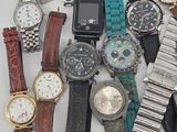 a lot of watches that are sitting on a table