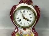 a small clock that is sitting on a table