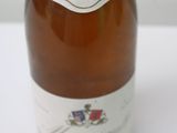 a bottle of wine that is sitting on a table