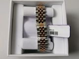 a box with a watch inside of it on a table