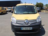 a yellow van that is parked in a parking lot