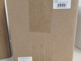a box that is sitting on the floor next to a wall