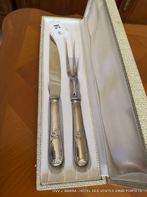a silverware set in a box on a table