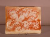 a plate with a picture of a group of people on it