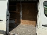 a white van with the door open on the street