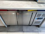 a stainless steel counter top with a microwave and a dishwasher