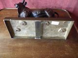 a statue of a bull on top of a wooden desk