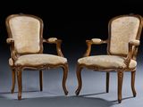 pair of louis xv style carved wood armchairs