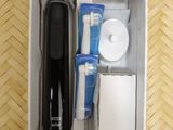 a box with a toothbrush, toothpaste, and other items in it