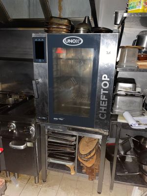 a large commercial oven in the middle of a kitchen