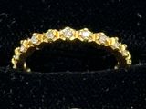 yellow gold wedding ring with diamonds on velvet display case