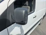 an image of a side view mirror of a white van