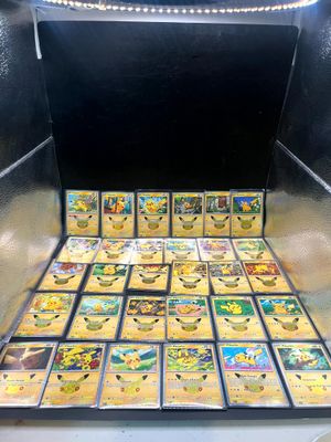 a box full of pokemon cards sitting on top of a table