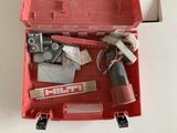 a red tool box with tools in it on a table