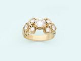 a close up of a diamond ring on a white background