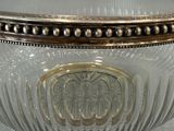 a glass bowl with a gold rim on a table