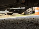 a close up view of a car under a vehicle