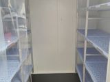 a small room with a lot of shelves in it