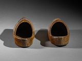 two wooden shoes that are sitting on a table