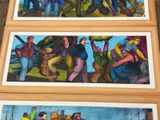several paintings of people are hanging on the wall of a building
