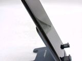 a cell phone that is sitting on top of a stand