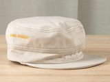 a white hat that is sitting on a wooden table