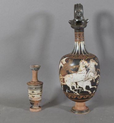 two vases sitting next to each other on a table