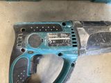 a close up of an electric drill on a table next to other tools