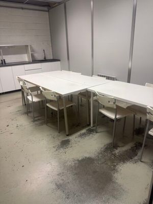 a room with a table and chairs in it