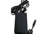 a close up of a charger with a cord and a charger plugged into it