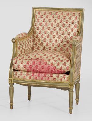 an image of a chair with a floral upholstered back and arms
