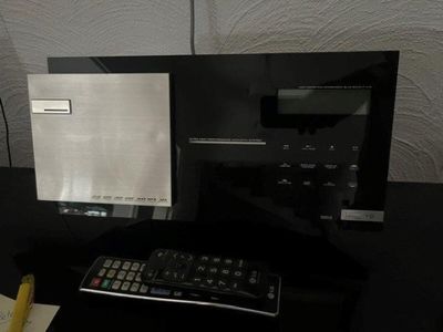 a computer monitor and a keyboard on a desk