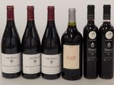 plusieurs bouteilles de vin sont alignées sur une table