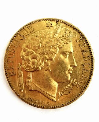 l'image d'une pièce d'or sur laquelle figure le visage d'une femme