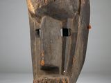 a close up of a wooden sculpture of a horse ' s head