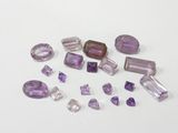 a group of amethorate and amethorate gems on a white surface