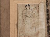 an old picture of a woman holding a baby in her arms