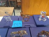 a lot of glass figurines on display on a table