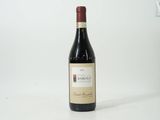 a bottle of wine that is sitting on a table