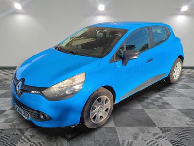a blue car is parked in a room with a checkered floor